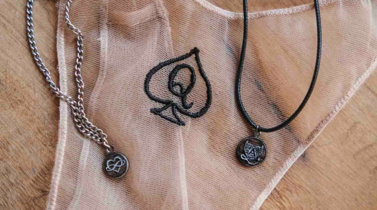 Hotwife symbols on sheer mesh lingerie with pendants