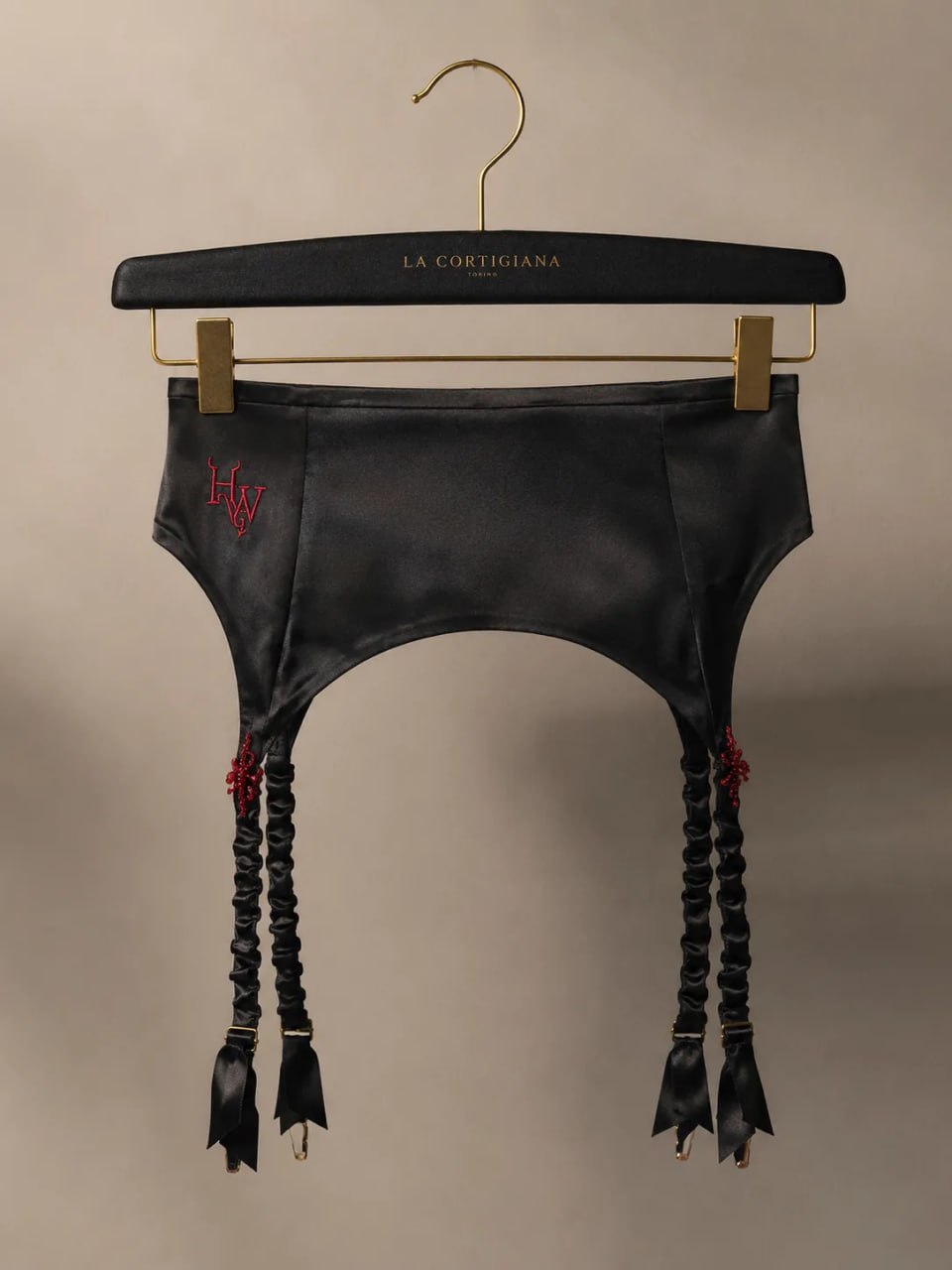 Atelier Garter handmade black satin accessory on La Cortigiana hanger
