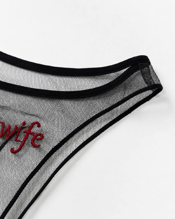 Close-up of black sheer mesh and red Hotwife embroidery